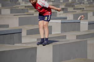 A child standing on a grey block