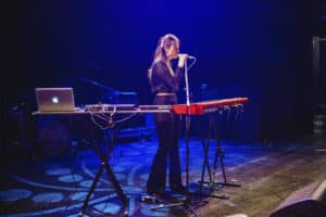 Ariane Voss performing on stage at the BIMM Berlin graduation