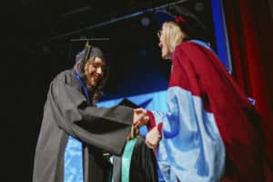 Students getting thanked on stage at the BIMM Berlin graduation 2022
