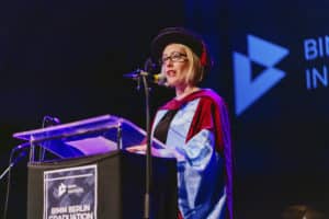 Claire Smith, on stage at the BIMM Berlin graduation 2022