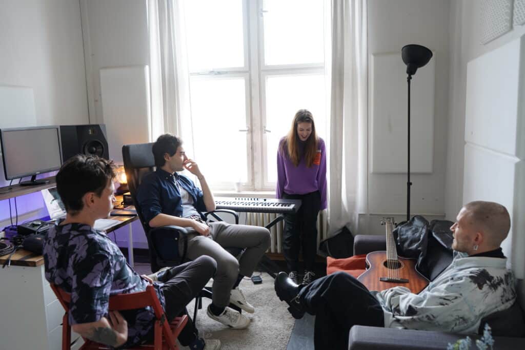 Students sit down and discuss at Berlin’s 2023 Songwriting Camp
