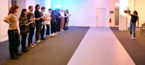 Students line up in acting class for a masterclass