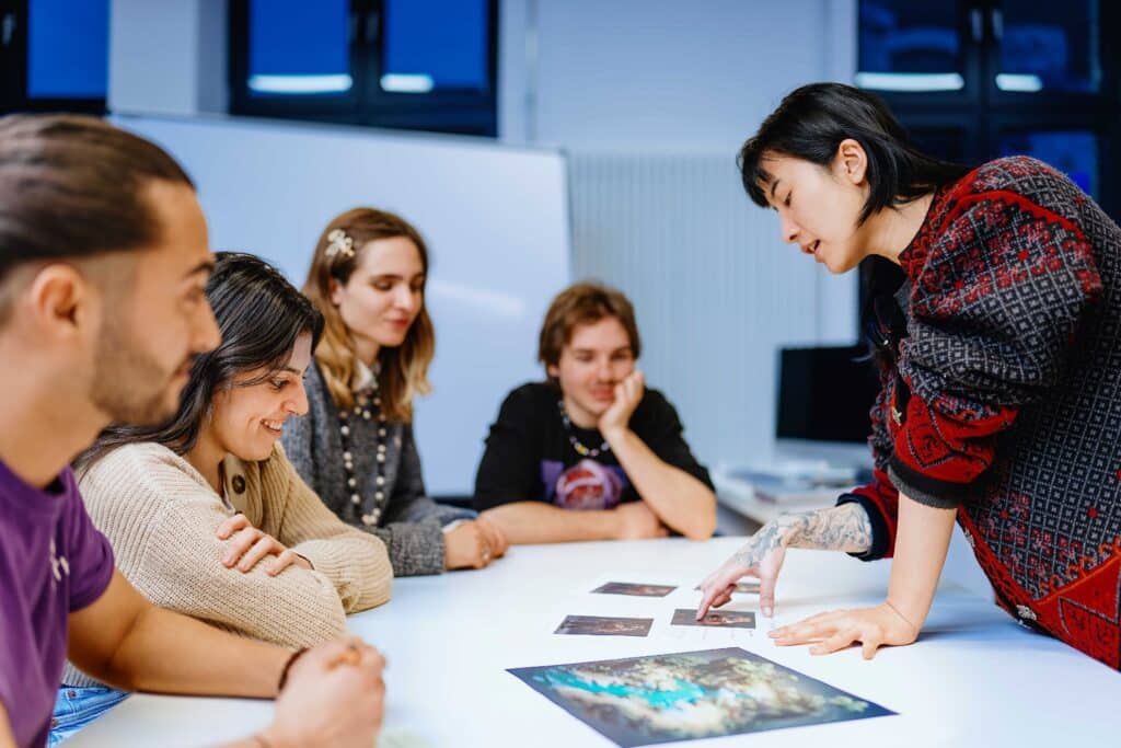 BIMM Berlin Game design students around a table talking