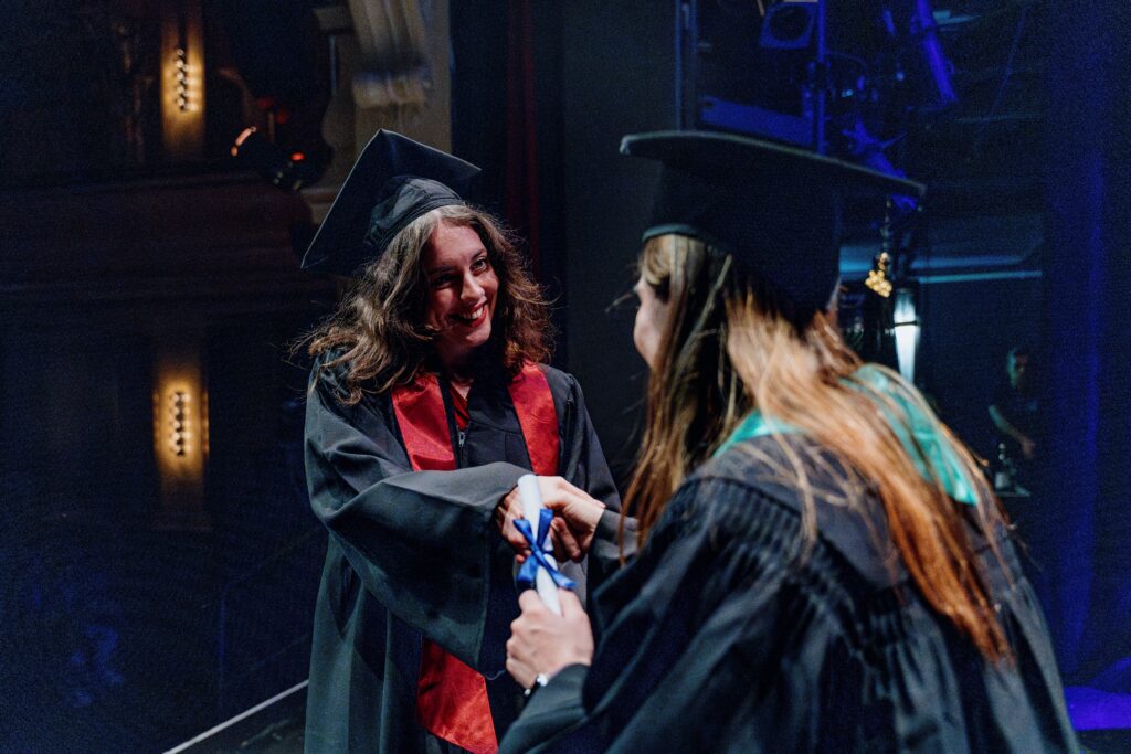 BIMM University Berlin’s 2023 graduation gig - student receiving diploma on stage