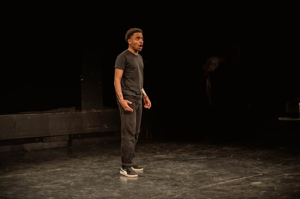 Berlin acting student on stage surprised.